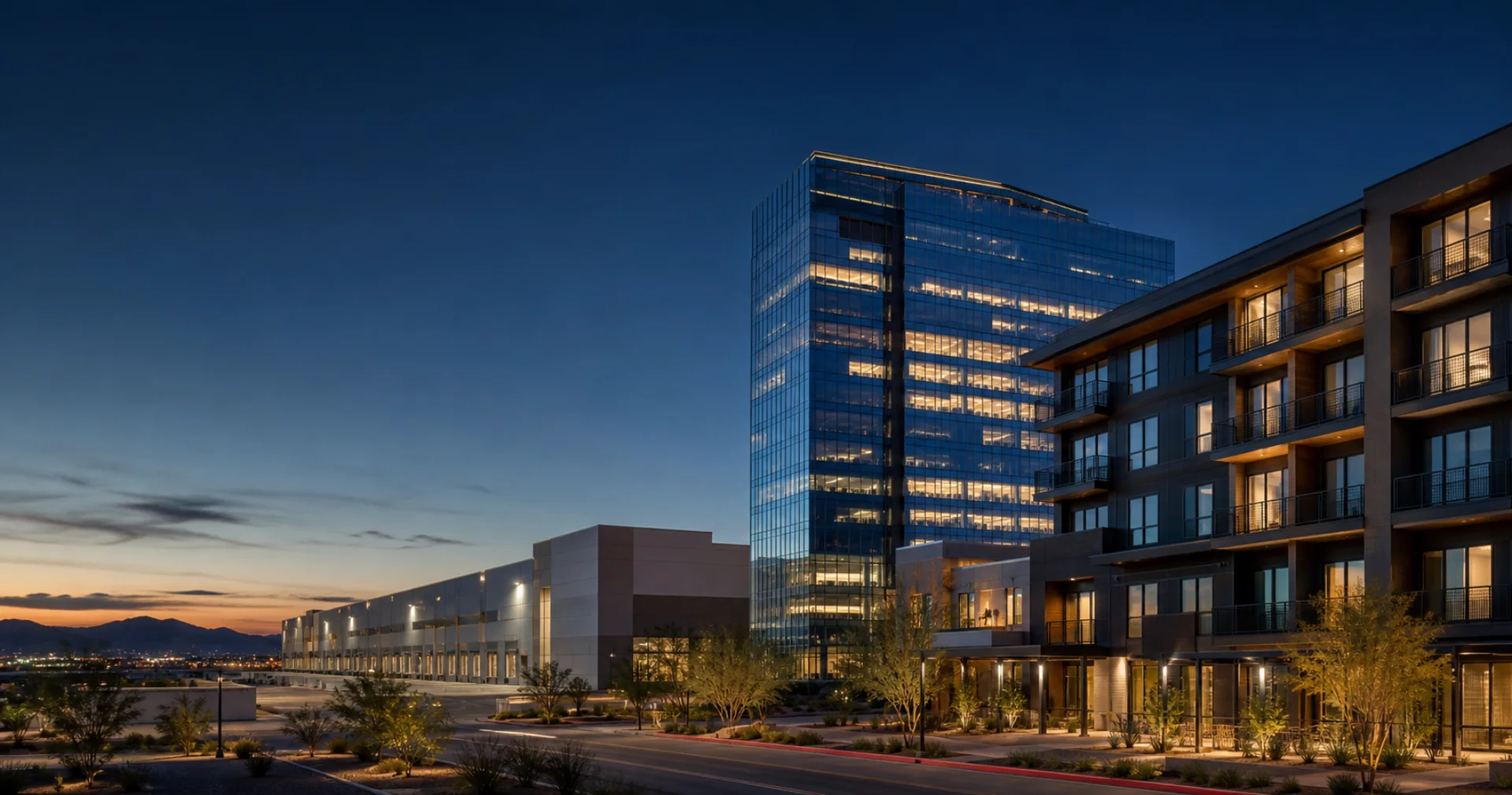 Commercial office, industrial, and multifamily properties at dusk